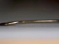 Photo of a standard fishing hook showing the "twist in the bend"  Photo of a standard fishing hook showing the "twist in the bend"